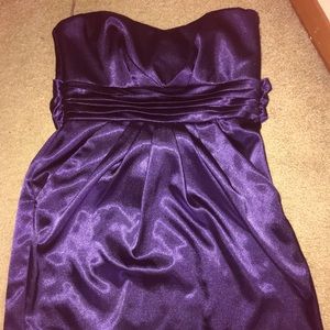 Eggplant purple strapless dress.